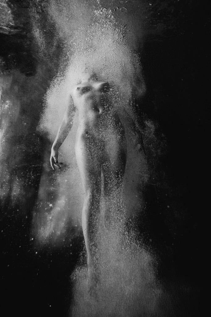 figure study of a body after plunging into the water during an underwater portrait photoshoot.
